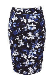 Product shot of The Tube Skirt in colour Fleur (Blue), from the back