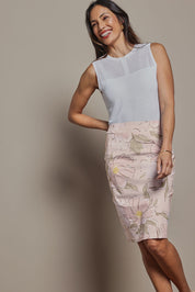 Model Amanda wearing size 10 of The Tube Skirt in colour Blushbloom (Pink), from the front, cropped image