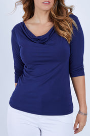 Model Laura wearing size 12 of The Reversible Cowl Neck Top in colour Navy (Blue), from the front, cropped image