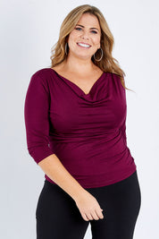 Model Fiona wearing size 16 of The Reversible Cowl Neck Top in colour Plum (Purple), from the front, cropped image