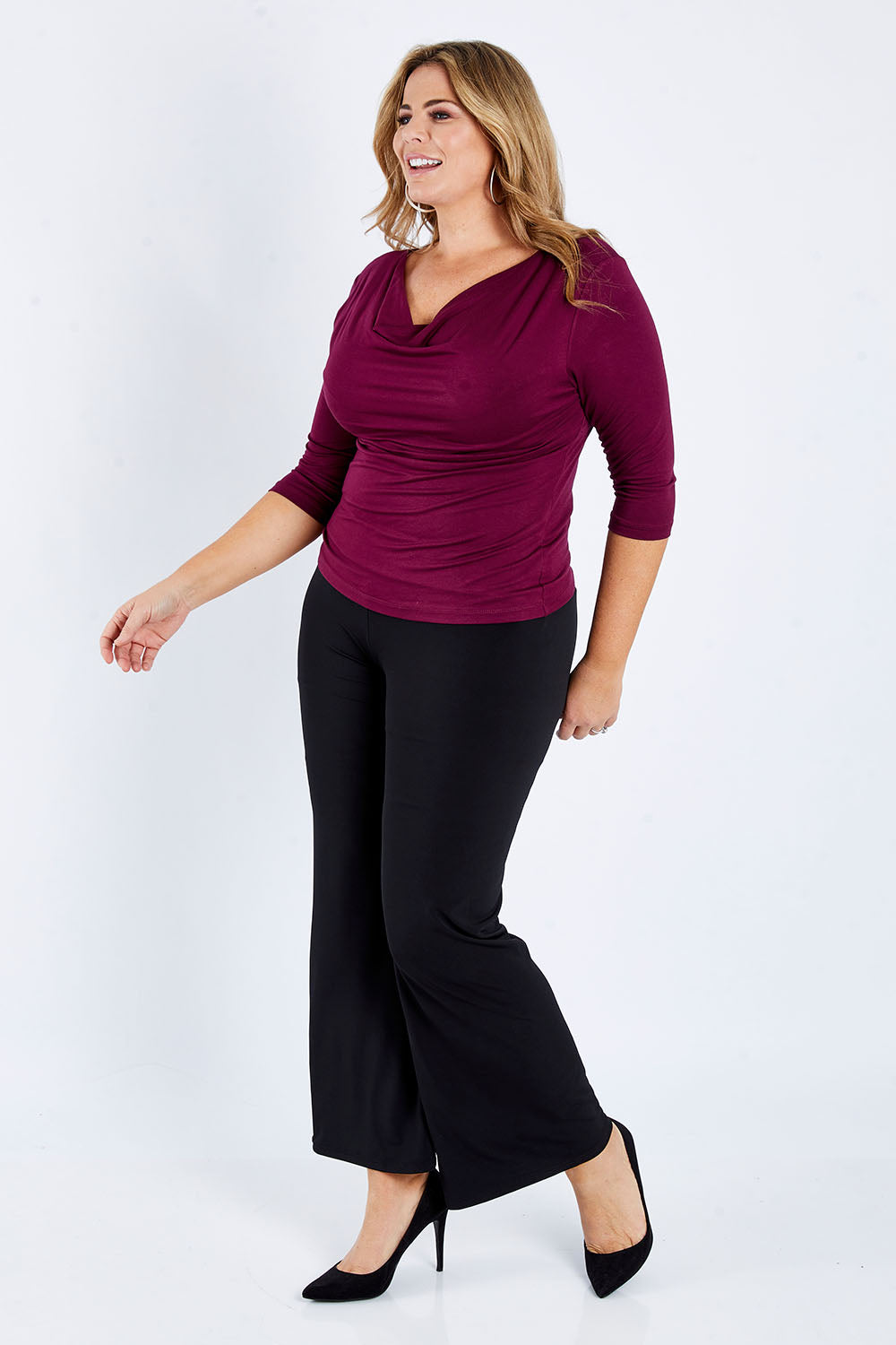 Model Fiona wearing size 16 of The Reversible Cowl Neck Top in colour Plum (Purple), from the front, showing the whole outfit