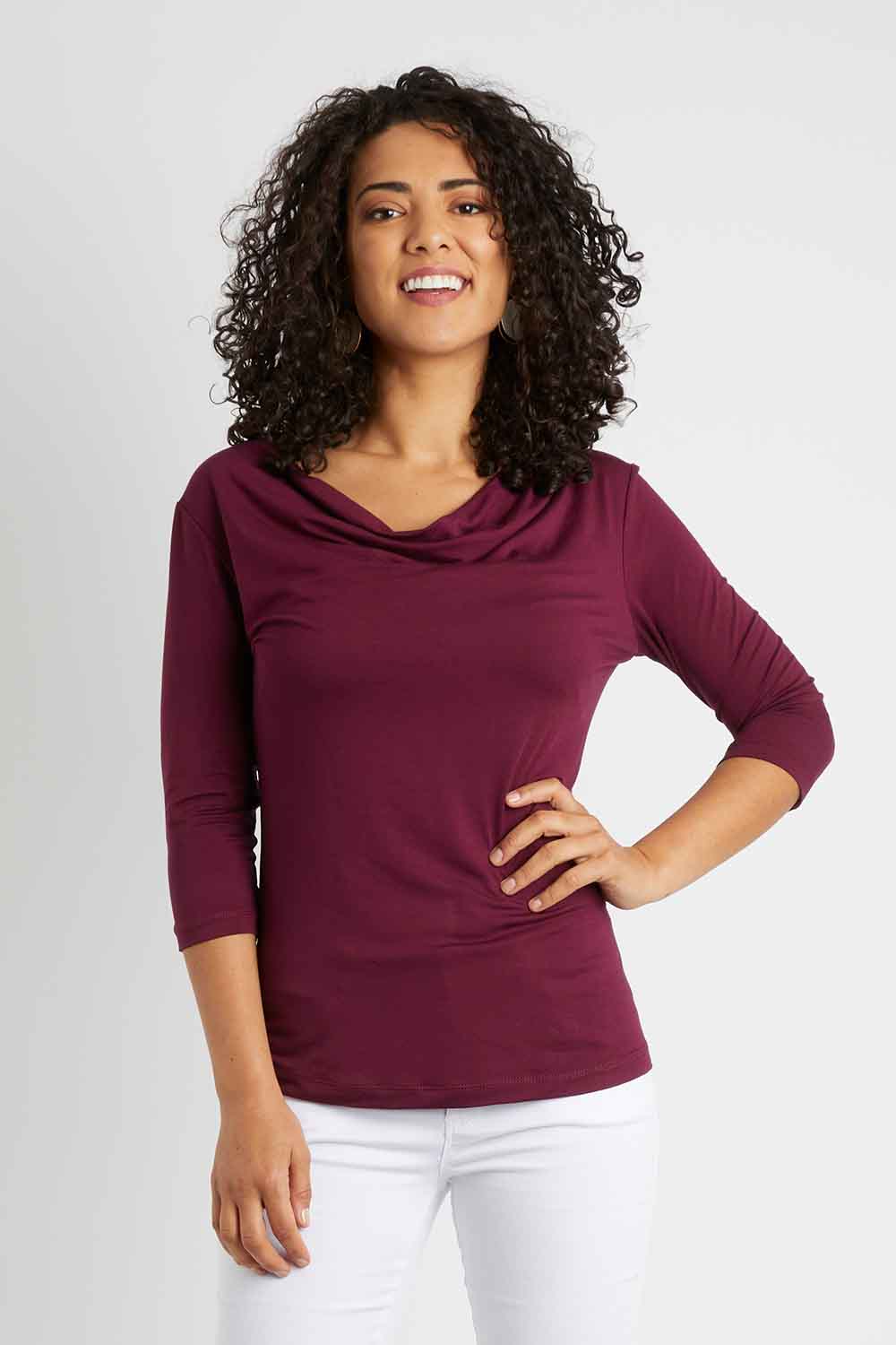 Model Pamela wearing size 10 of The Reversible Cowl Neck Top in colour Plum (Purple), from the front, cropped image