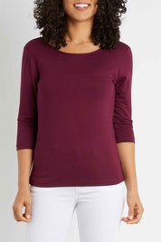 Model Pamela wearing size 10 of The Reversible Cowl Neck Top in colour Plum (Purple), from the front, cropped image