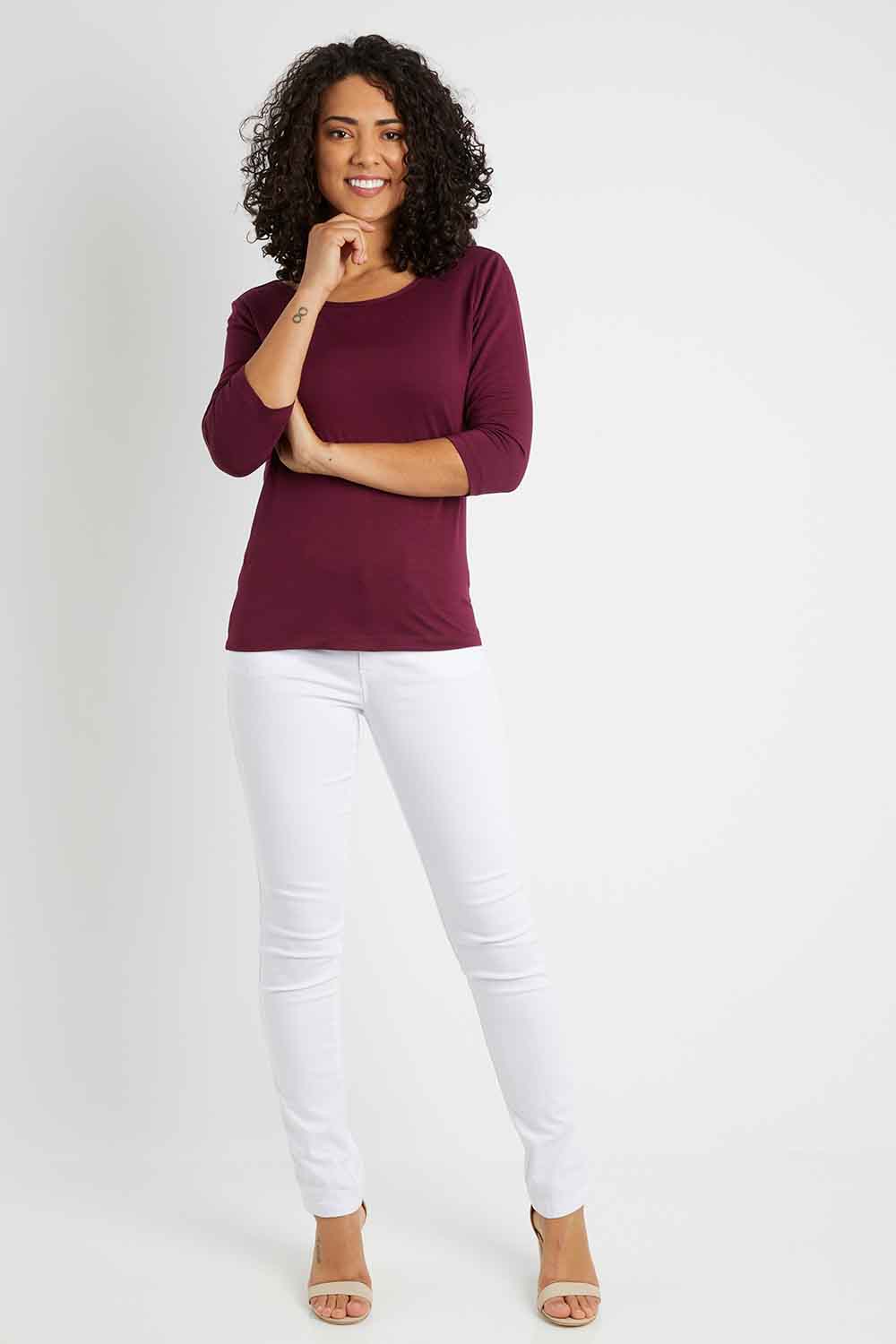 Model Pamela wearing size 10 of The Reversible Cowl Neck Top in colour Plum (Purple), from the front, showing the whole outfit