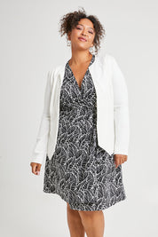 Model Alexis wearing size 16 of The Adore Jacket in colour Ivory (White), from the front, showing the whole outfit