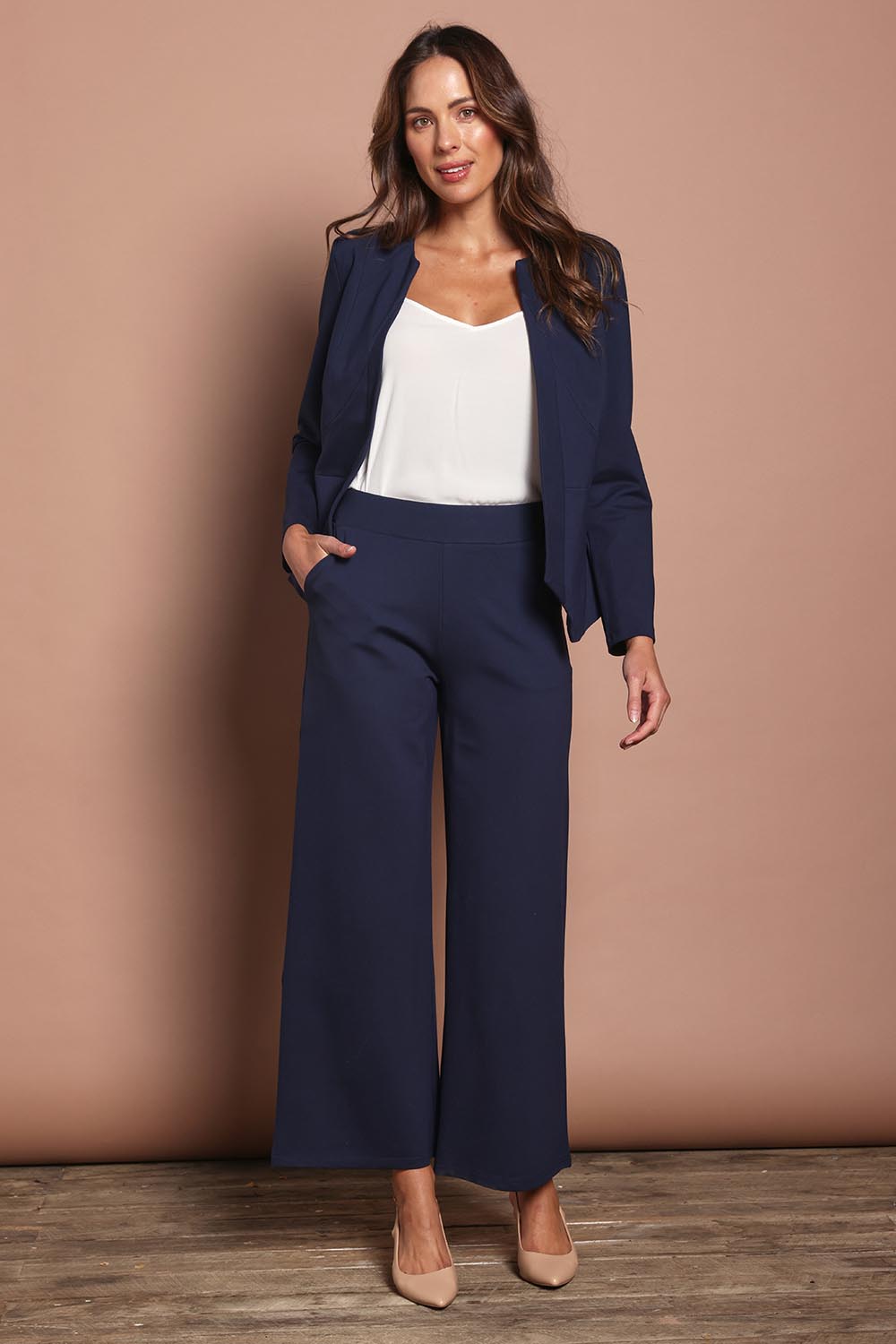 Model Madeline wearing size 10 of The Ponte Adore Jacket in colour Darknavy (Blue), from the front, showing the whole outfit