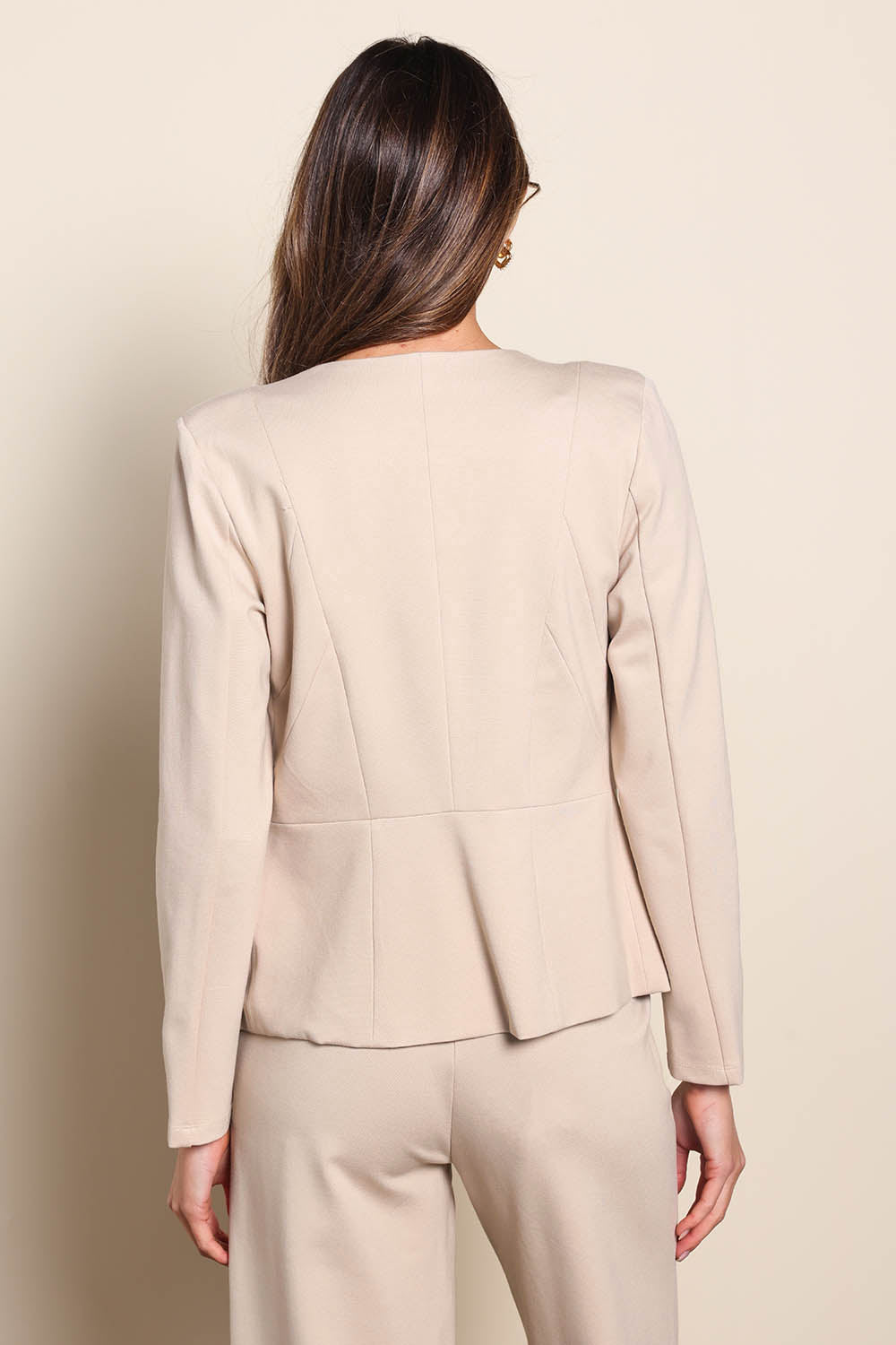 Model Madelinec wearing size 10 of the The Ponte Adore Jacket – Sand in colour Sand, from the back