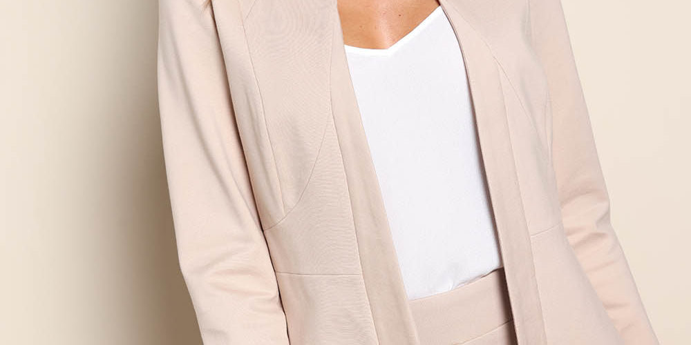 Model Madelinec wearing size 10 of the The Ponte Adore Jacket – Sand in colour Sand, in a cropped view