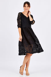 Model Monique wearing size 8 of The 3/4 Sleeve Lace Dress in colour Black (Black), from the front, showing the whole outfit