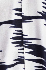 Product shot of the Belle Printed Jumpsuit in colour Strokes (Blue), detail