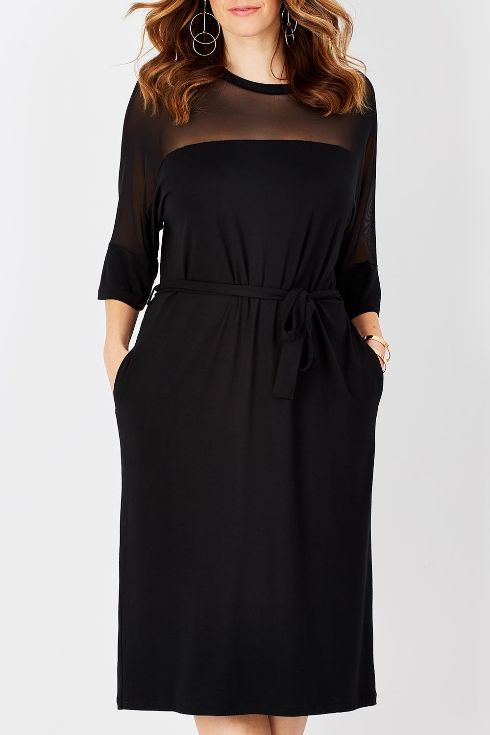 Model Laura wearing size 12 of the Belle Mesh Yoke Dress in colour Back (Black), from the front, cropped image