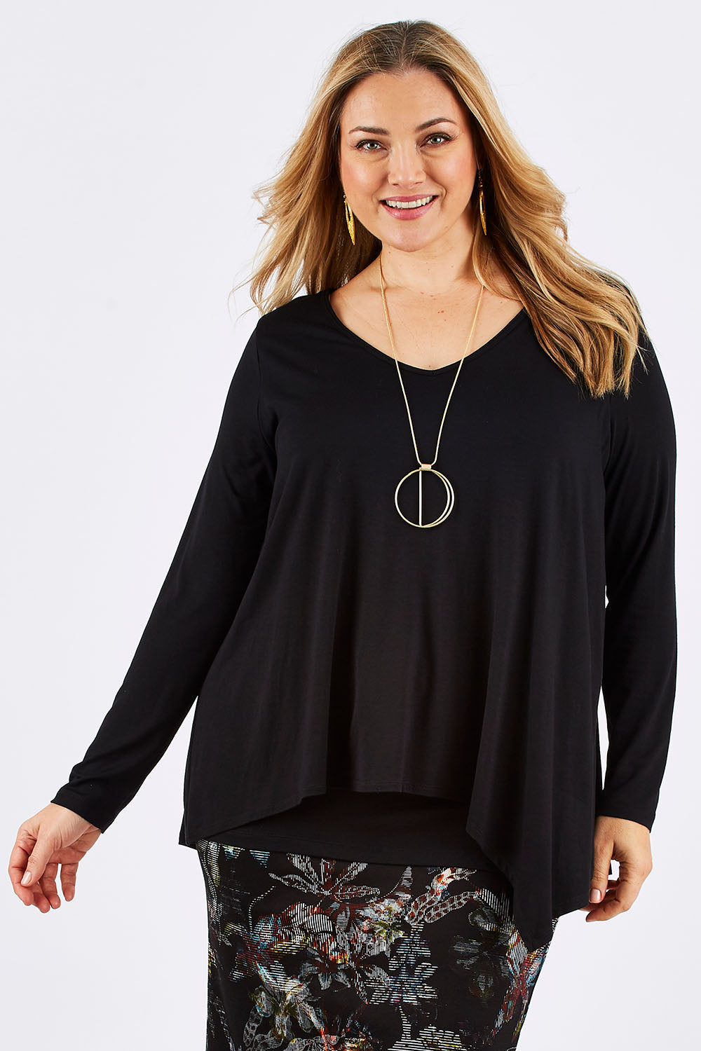 Model Ljubenka wearing size 16 of the Belle V Neck Forgiver Tunic in colour Black (Black), from the front, cropped image