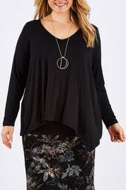 Model Ljubenka wearing size 16 of the Belle V Neck Forgiver Tunic in colour Black (Black), from the front, cropped image