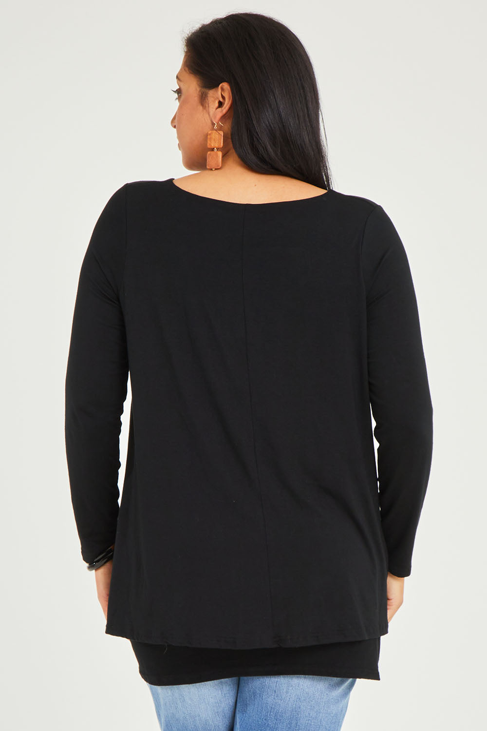 Model Terri-Leigh wearing size 14 of the Belle V Neck Forgiver Tunic in colour Black (Black), from the back