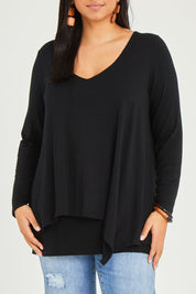 Model Terri-Leigh wearing size 14 of the Belle V Neck Forgiver Tunic in colour Black (Black), from the front, cropped image