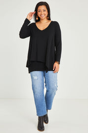 Model Terri-Leigh wearing size 14 of the Belle V Neck Forgiver Tunic in colour Black (Black), from the front, showing the whole outfit