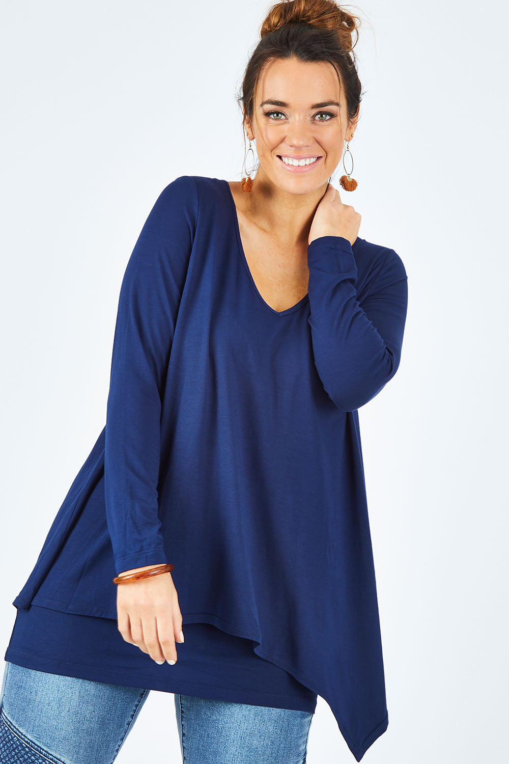 Model Laura wearing size 12 of the Belle V Neck Forgiver Tunic in colour Navy (Blue), from the front, cropped image