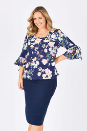 Model Jess wearing size 14 of the Belle Textured Pencil Skirt in colour Navy (Blue), from the front, cropped image