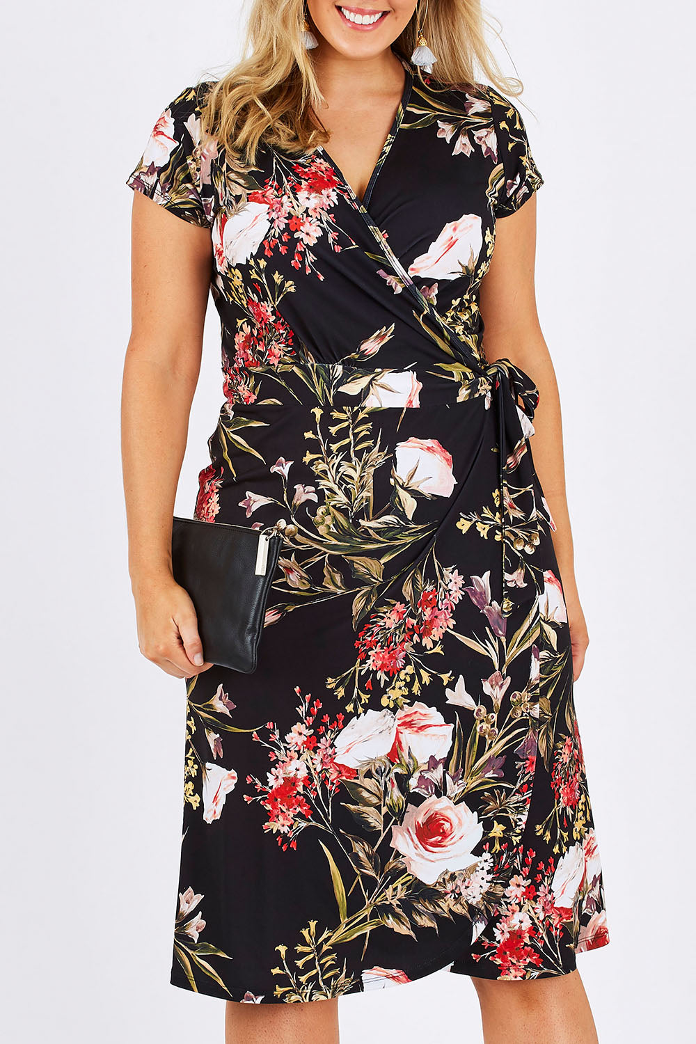 Model Jess wearing size 12 of the Belle Orange Blossom Wrap Dress in colour BlosPrint, from the front, cropped image