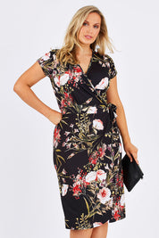 Model Jess wearing size 12 of the Belle Orange Blossom Wrap Dress in colour BlosPrint, from the front, cropped image