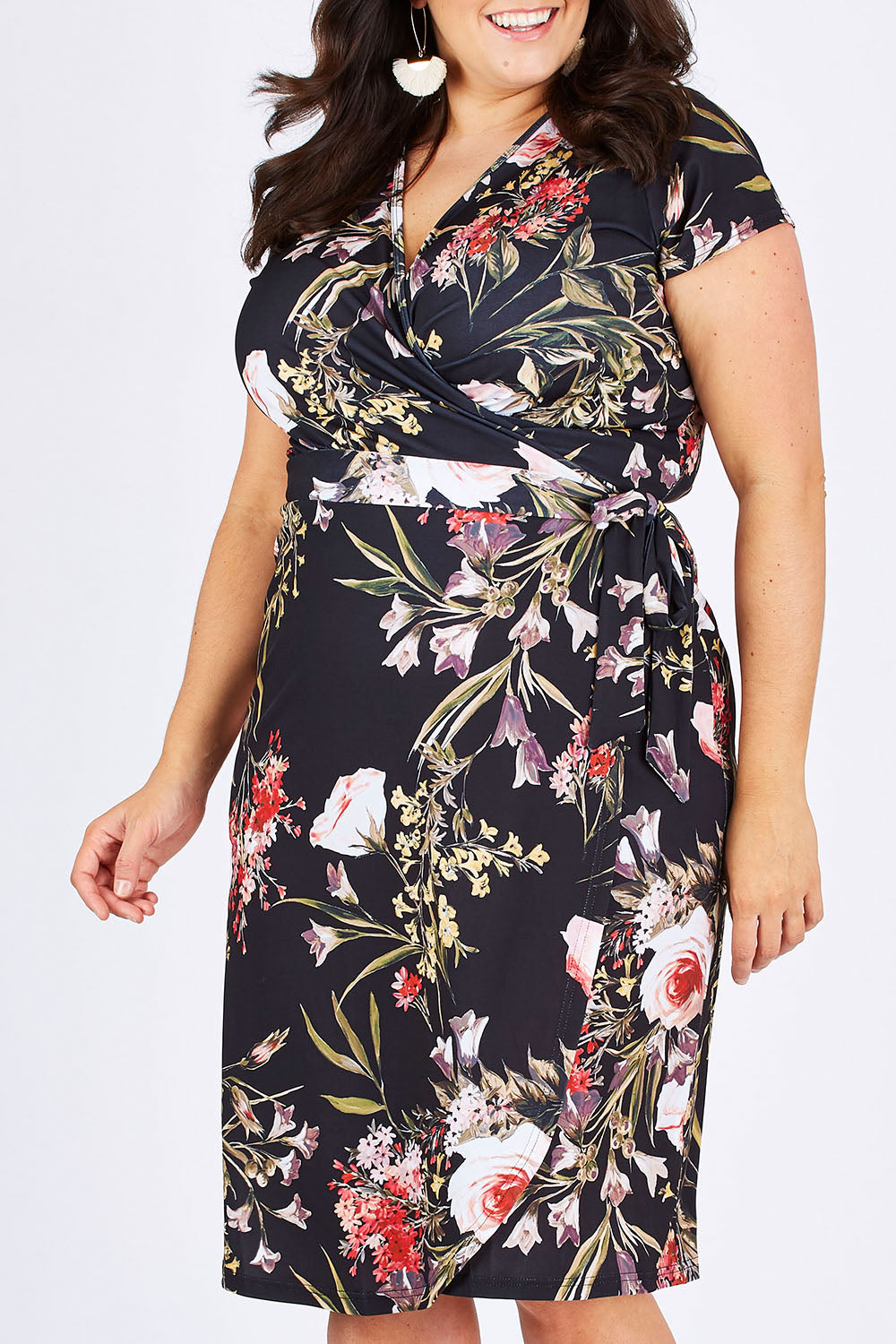 Model Mae wearing size 18 of the Belle Orange Blossom Wrap Dress in colour BlosPrint, from the front, cropped image