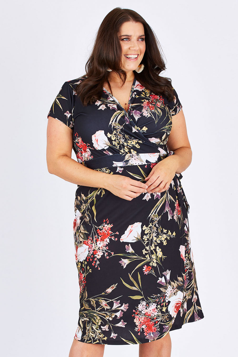 Model Mae wearing size 18 of the Belle Orange Blossom Wrap Dress in colour BlosPrint, from the front, cropped image