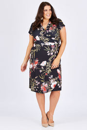 Model Mae wearing size 18 of the Belle Orange Blossom Wrap Dress in colour BlosPrint, from the front, showing the whole outfit