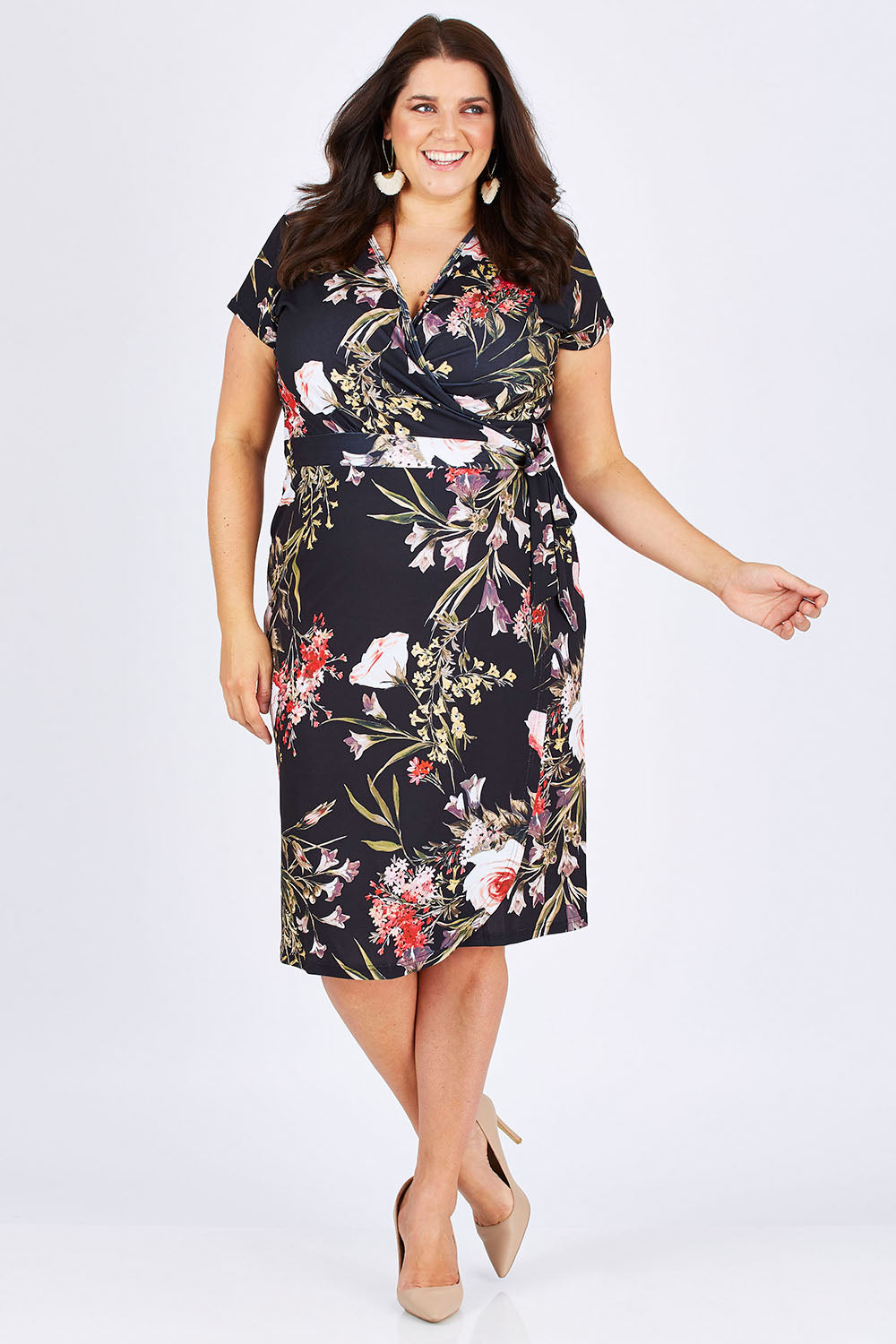 Model Mae wearing size 18 of the Belle Orange Blossom Wrap Dress in colour BlosPrint, from the front, showing the whole outfit