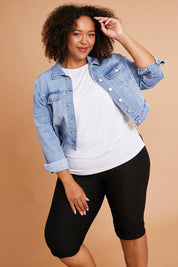 Model Alexis wearing size 16 of the Belle Knee Short in colour Black (Black), from the front, showing the whole outfit