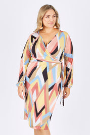 Model Ljubenka wearing size 16 of the Belle Pastel Geometric Wrap Dress in colour Pastel, from the front, cropped image