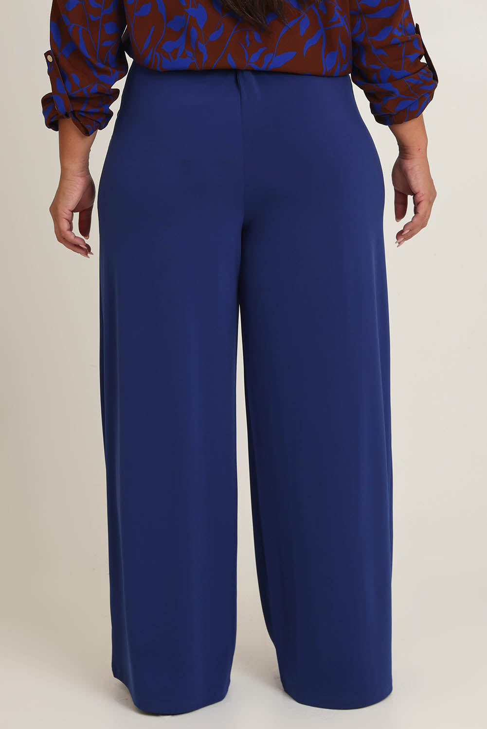 Model Ashleigh wearing size 16 of the Belle Wide Leg Pant in colour Frenchnavy (Blue), from the back