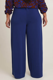 Model Ashleigh wearing size 16 of the Belle Wide Leg Pant in colour Frenchnavy (Blue), from the back