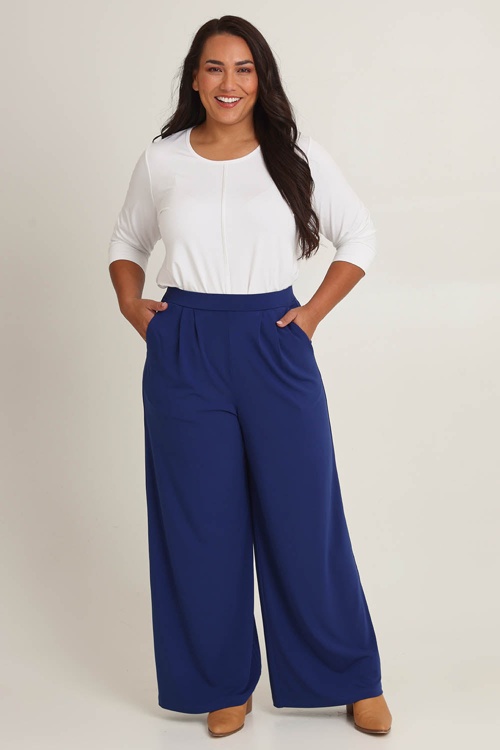 Model Ashleigh wearing size 16 of the Belle Wide Leg Pant in colour Frenchnavy (Blue), from the front, showing the whole outfit