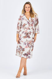 Model Jess wearing size 12 of the Belle Crepe Wrap Dress in colour Leaf (White), from the front, showing the whole outfit