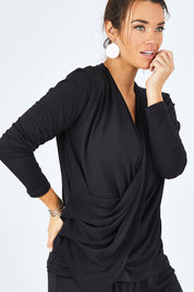Model Laura wearing size 12 of the Belle Drape Tee in colour Black (Black), from the front, cropped image