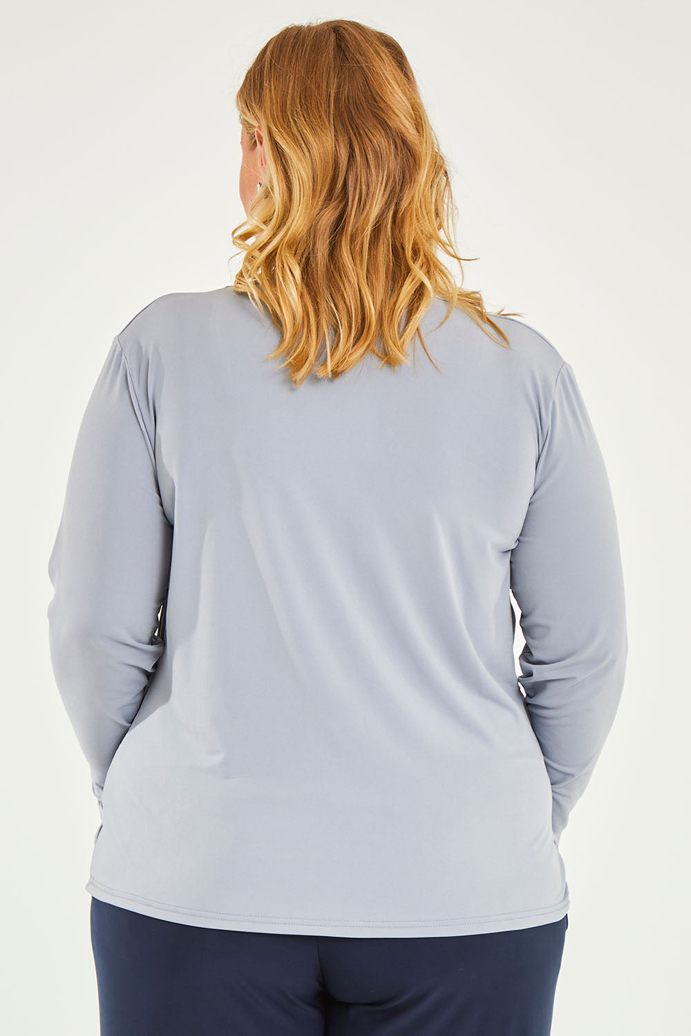 Model Caitlin wearing size 20 of the Belle Drape Tee in colour Sliver (Grey), from the back