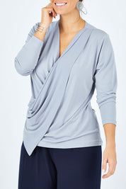 Model Laura wearing size 12 of the Belle Drape Tee in colour Sliver (Grey), from the front, cropped image