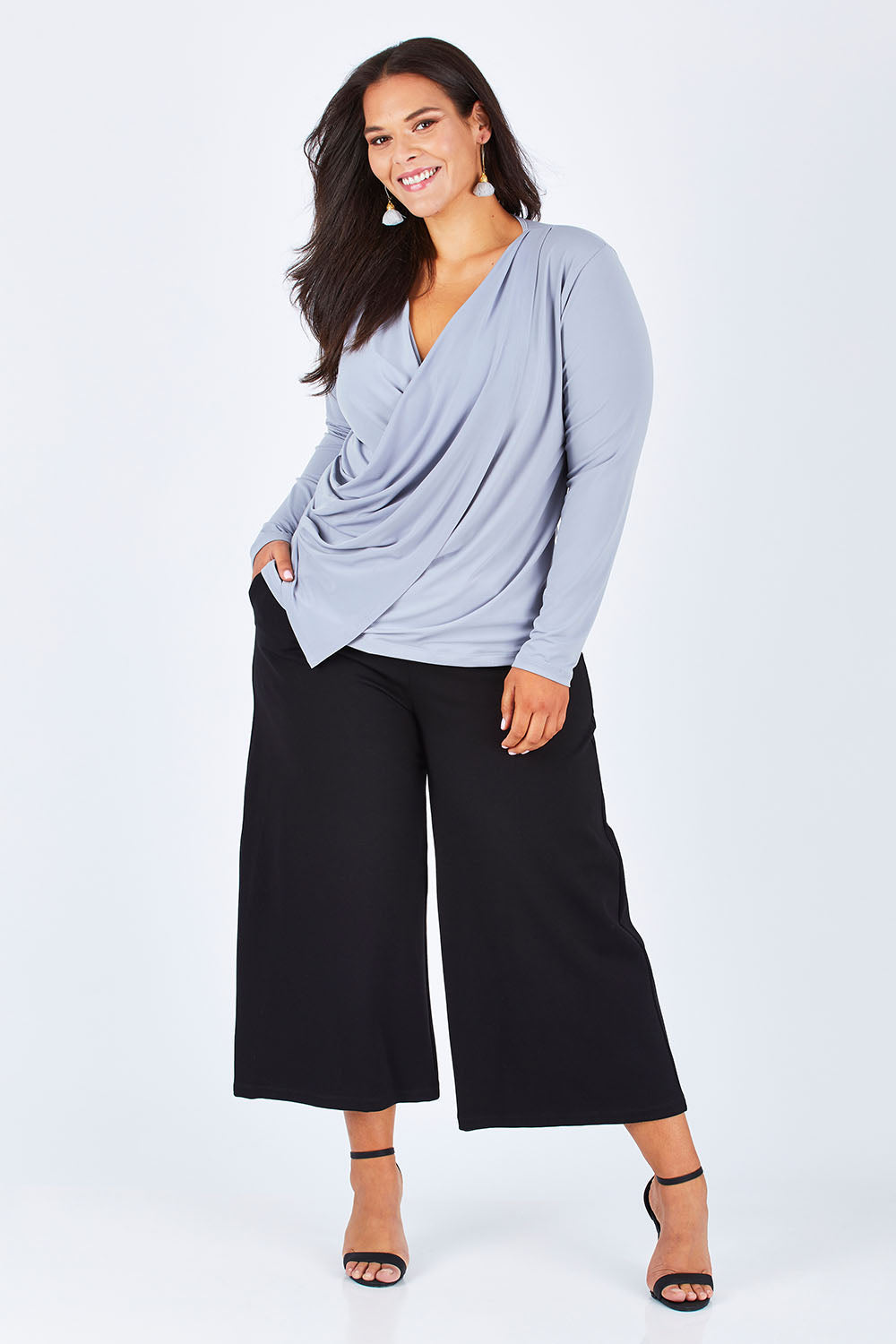 Model Lauren wearing size 16 of the Belle Drape Tee in colour Sliver (Grey), from the front, showing the whole outfit