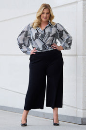 Model Caitlin wearing size 18 of the Belle Palazzo Ponte Crop in colour Black (Black), from the front, showing the whole outfit