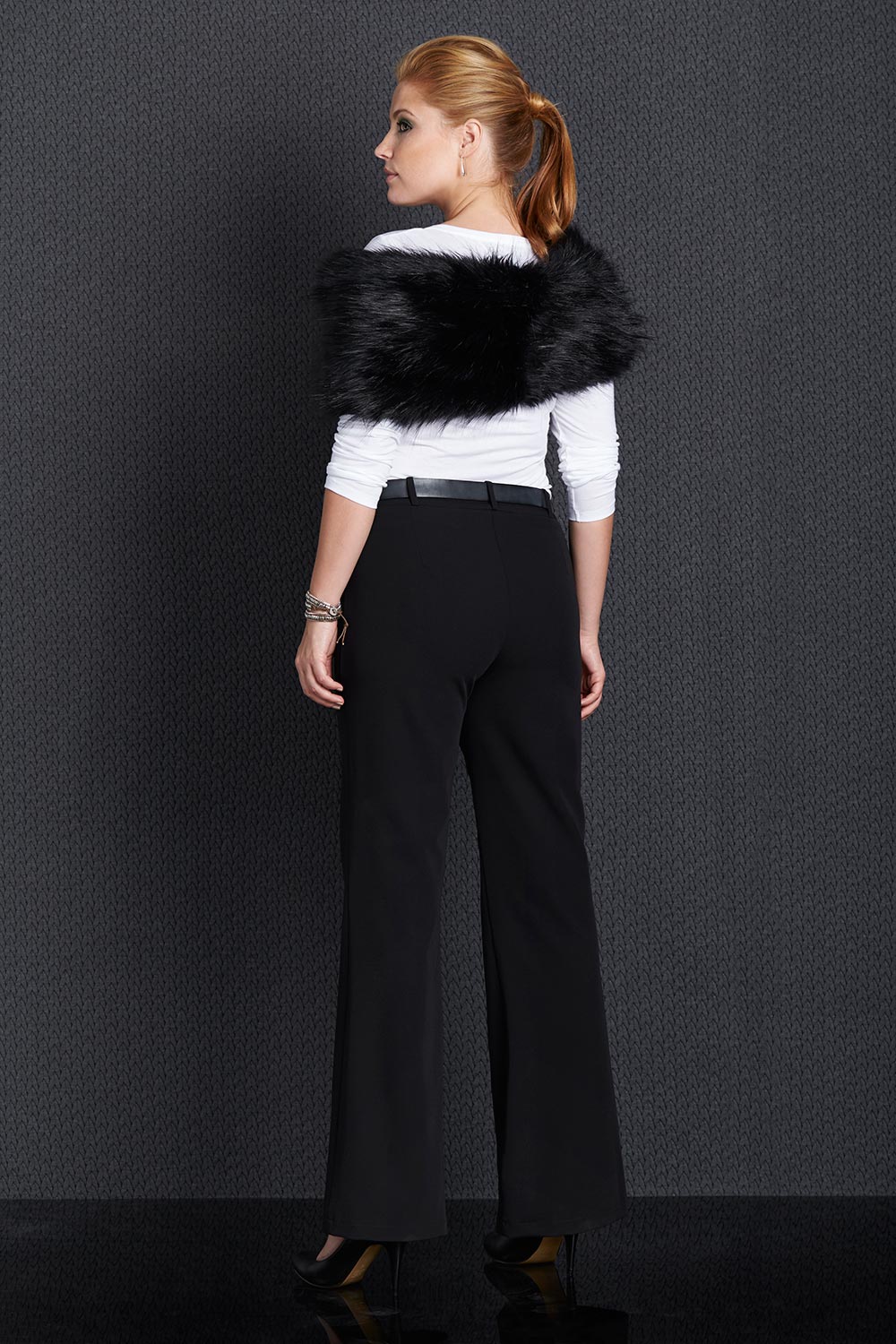A model wearing size 12 of the Belle Suit Pants in colour Black (Black), from the front, showing the whole outfit