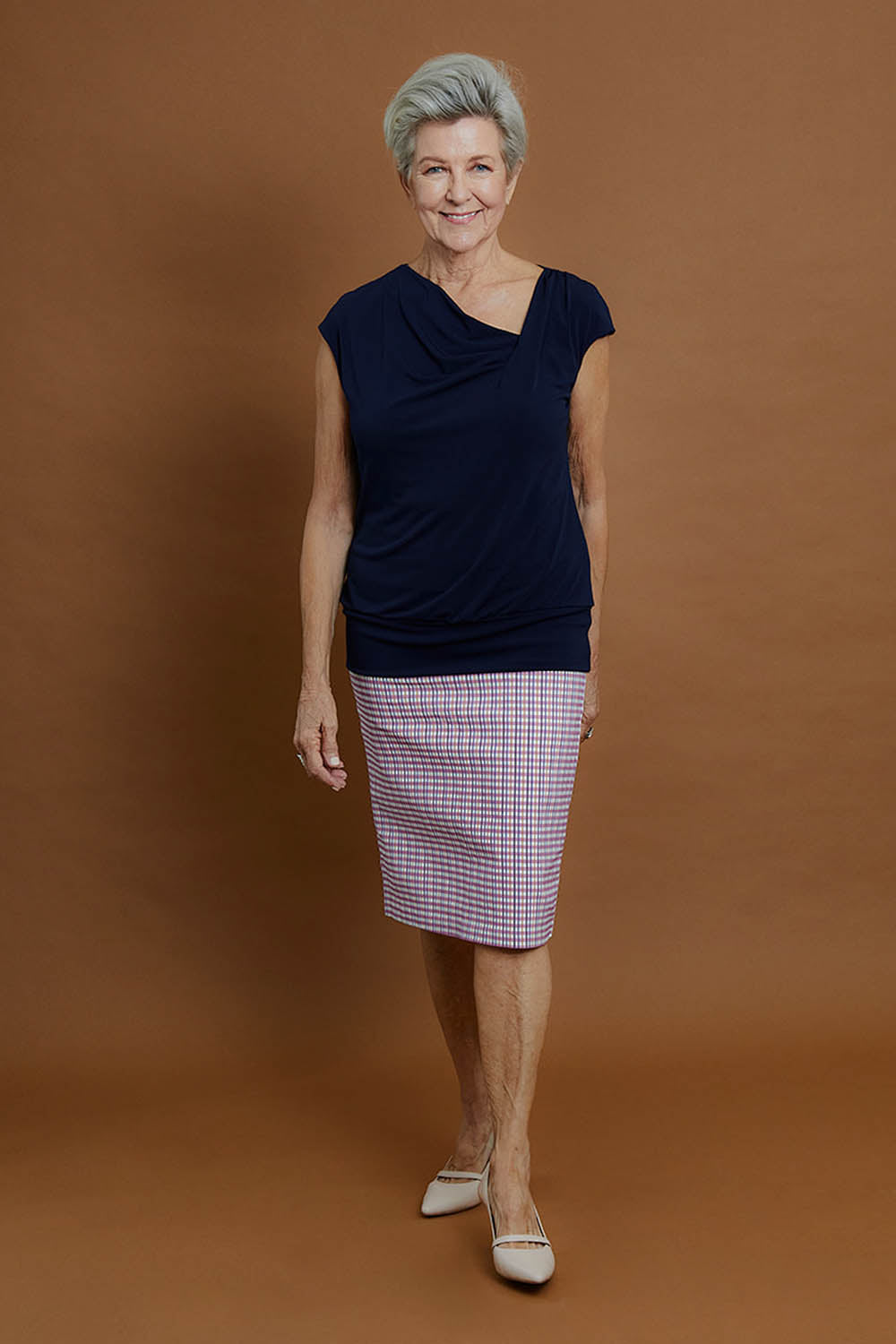 Model Elise wearing size 10 of the Belle Knit Square Neck Top in colour Navy (Blue), from the front, showing the whole outfit