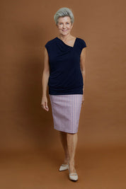 Model Elise wearing size 10 of the Belle Knit Square Neck Top in colour Navy (Blue), from the front, showing the whole outfit