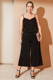 Model Jess wearing size 12 of the Belle Dress Pant in colour Black (Black), from the front, showing the whole outfit