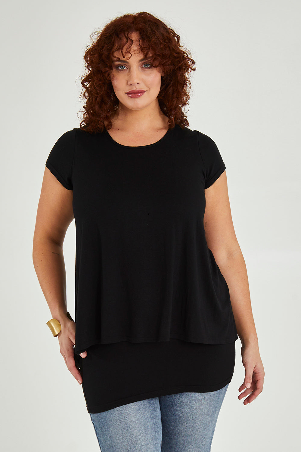 Model Maddy wearing size 16 of the Belle New Cap Sleeve Forgiver Tee in colour Black (Black), from the front, cropped image