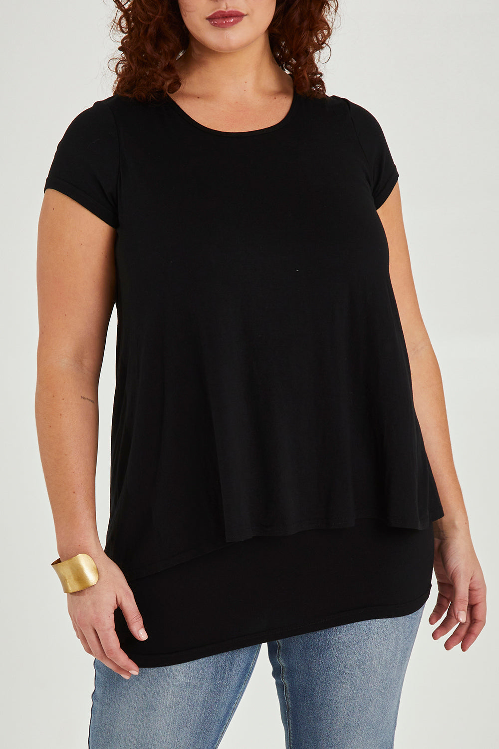 Model Maddy wearing size 16 of the Belle New Cap Sleeve Forgiver Tee in colour Black (Black), from the front, cropped image