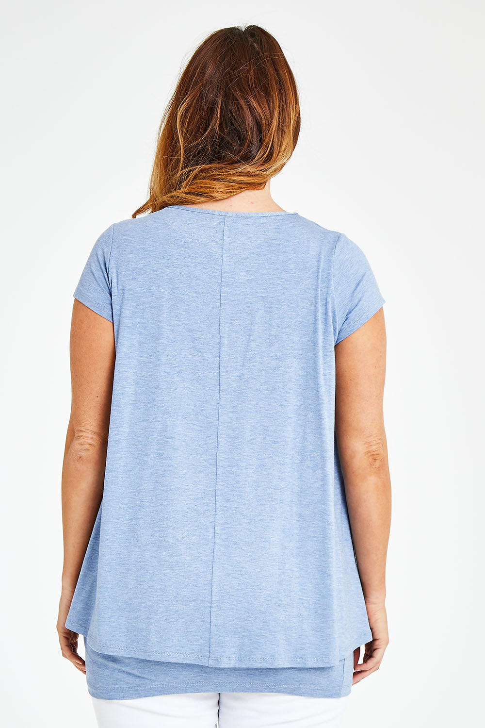 Model Laura wearing size 12 of the Belle New Cap Sleeve Forgiver Tee in colour Chambray (Blue), from the back