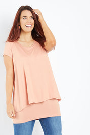Model Laura wearing size 12 of the Belle New Cap Sleeve Forgiver Tee in colour Mutedclay, from the front, cropped image