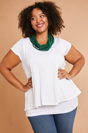 Model Alexis wearing size 16 of the Belle New Cap Sleeve Forgiver Tee in colour Vanilla (White), from the front, showing the whole outfit