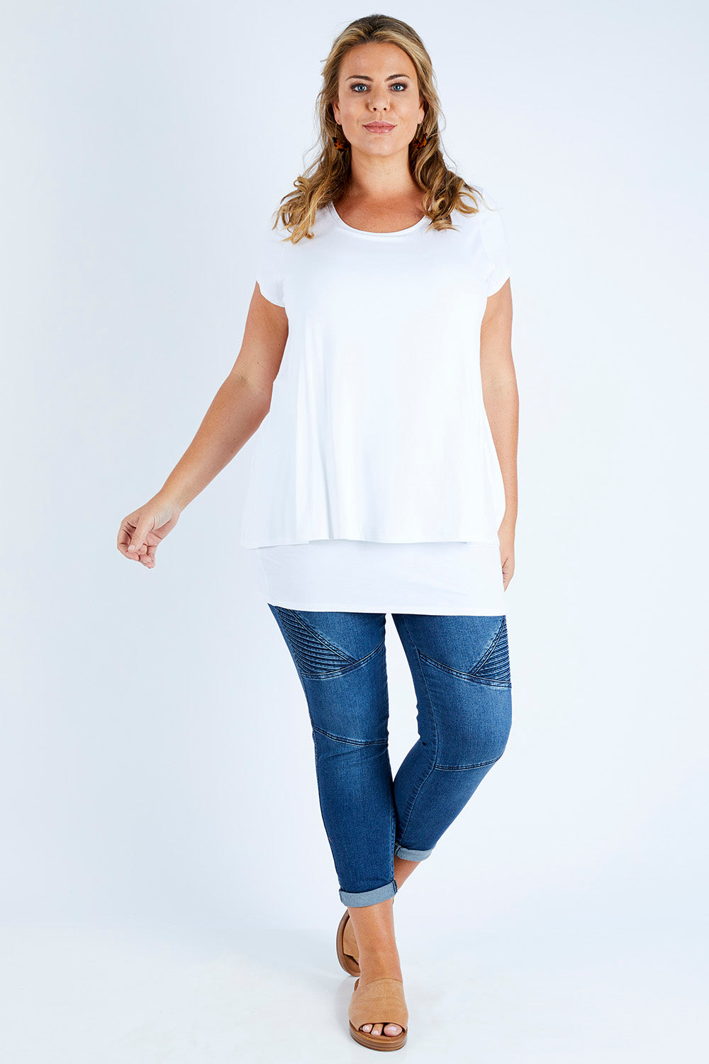 Model Fiona wearing size 16 of the Belle New Cap Sleeve Forgiver Tee in colour Vanilla (White), from the front, showing the whole outfit