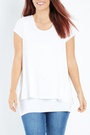 Model Laura wearing size 12 of the Belle New Cap Sleeve Forgiver Tee in colour Vanilla (White), from the front, cropped image